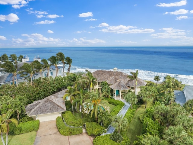 aerial view with a water view and a beach view