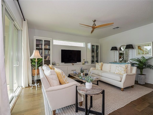 2284 Timberlake Cir, Vero Beach, FL 32966 - living area with light wood-type flooring and a ceiling fan