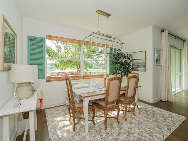 2284 Timberlake Cir, Vero Beach, FL 32966 - dining space featuring baseboards and wood finished floors