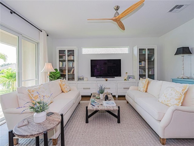 2284 Timberlake Cir, Vero Beach, FL 32966 - living room with healthy amount of natural light and ceiling fan