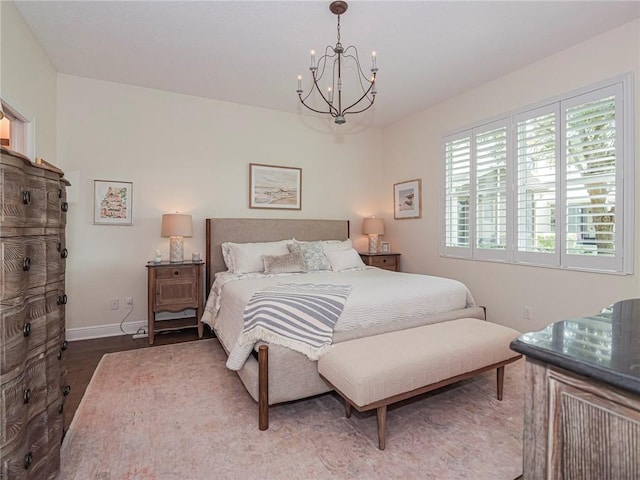 2284 Timberlake Cir, Vero Beach, FL 32966 - bedroom with a chandelier and wood finished floors
