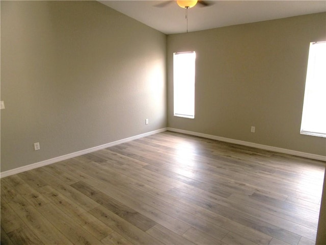 1465 24th Ave SW, Vero Beach, FL 32962 - spare room featuring a ceiling fan, wood finished floors, and baseboards