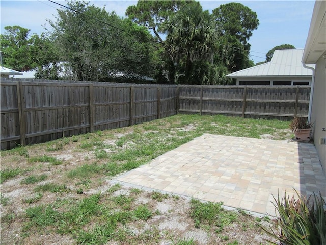 1465 24th Ave SW, Vero Beach, FL 32962 - fenced backyard with a patio