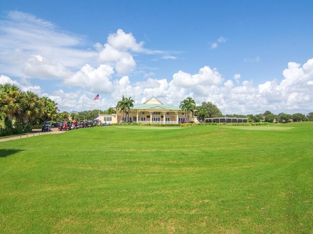 7639 15th Ln, Vero Beach, FL 32966 - view of home's community featuring a lawn