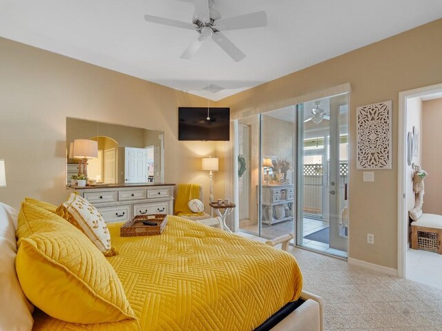 7639 15th Ln, Vero Beach, FL 32966 - bedroom featuring access to exterior, light colored carpet, ceiling fan, and baseboards