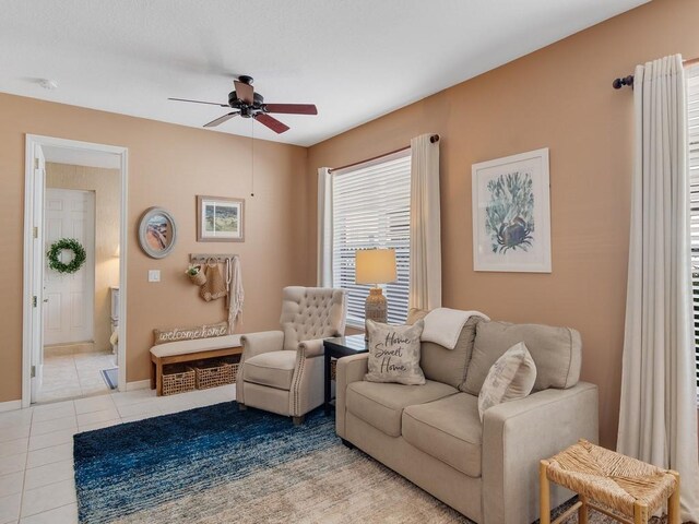 7639 15th Ln, Vero Beach, FL 32966 - living room with a ceiling fan, tile patterned floors, and baseboards