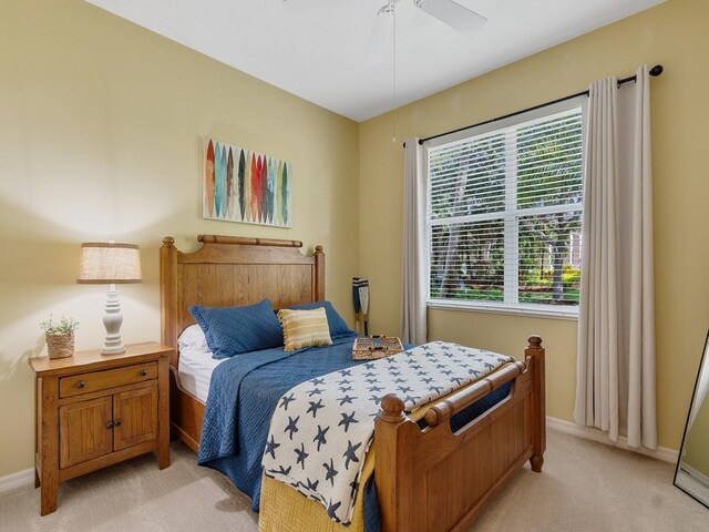 7639 15th Ln, Vero Beach, FL 32966 - bedroom with light colored carpet, baseboards, and ceiling fan