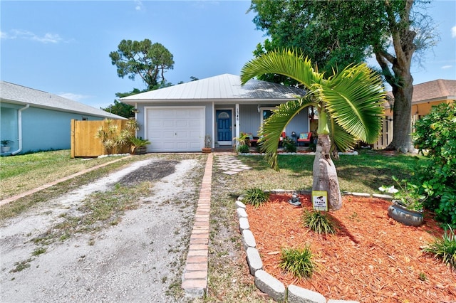 1346 22nd Ave SW, Vero Beach, FL 32962 - ranch-style home featuring dirt driveway, a garage, and metal roof
