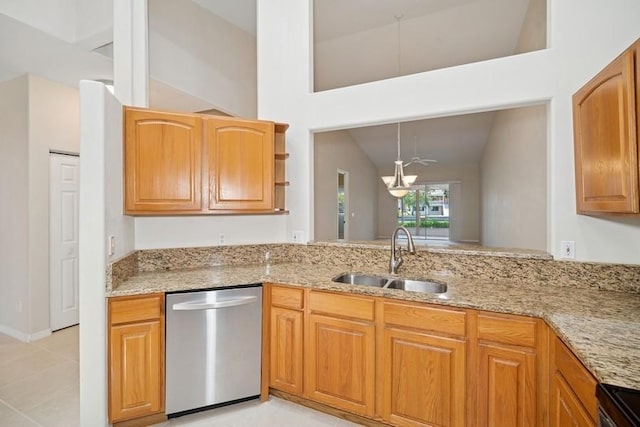 kitchen featuring appliances with stainless steel finishes, light stone counters, light tile patterned flooring, pendant lighting, and brown cabinetry