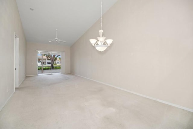 spare room with a chandelier, carpet floors, ceiling fan, and high vaulted ceiling