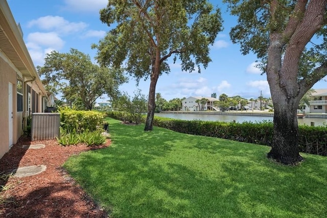 view of grassy yard with a water view