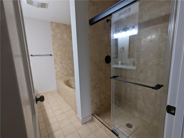 full bath with a shower stall, tile patterned floors, visible vents, and a bath