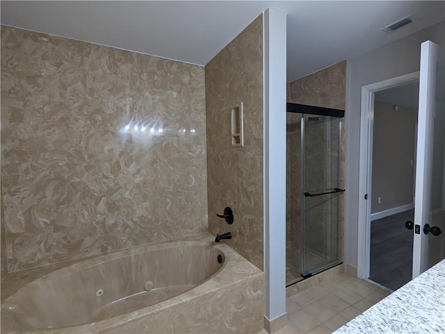bathroom featuring a stall shower, tile patterned floors, visible vents, and a whirlpool tub