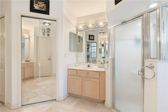 bathroom featuring vanity and walk in shower