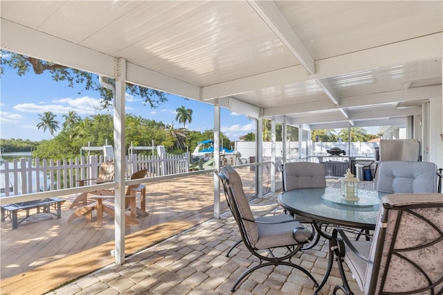 sunroom / solarium with beamed ceiling