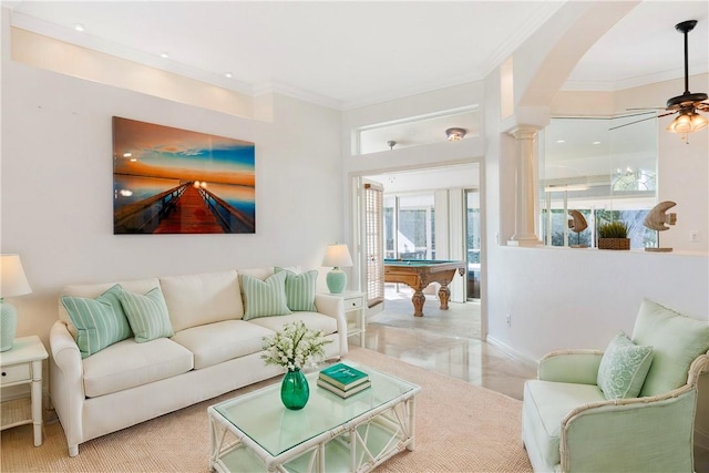 living room featuring ceiling fan, ornamental molding, and pool table