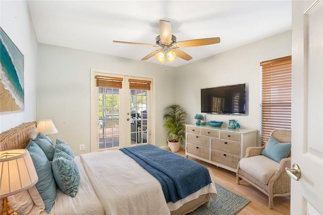 bedroom featuring ceiling fan, access to exterior, light wood-type flooring, and french doors