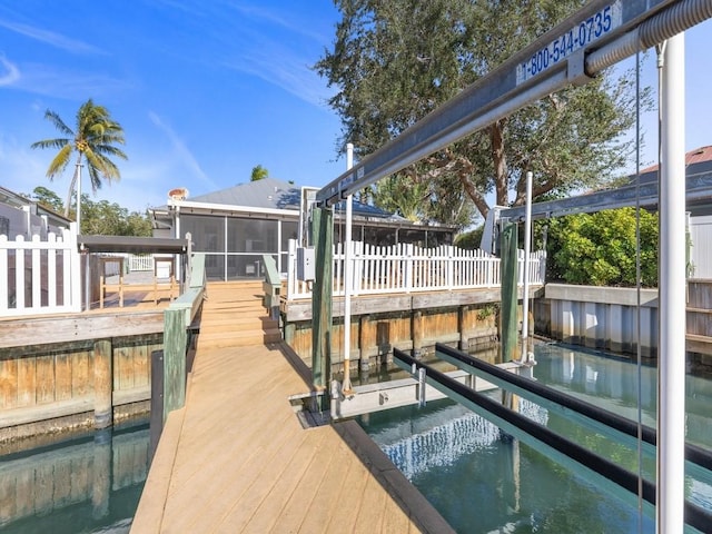 dock area featuring a water view