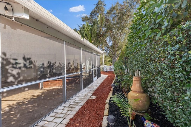 view of yard with a sunroom