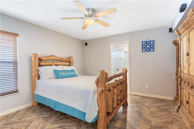 bedroom with dark parquet floors and ceiling fan