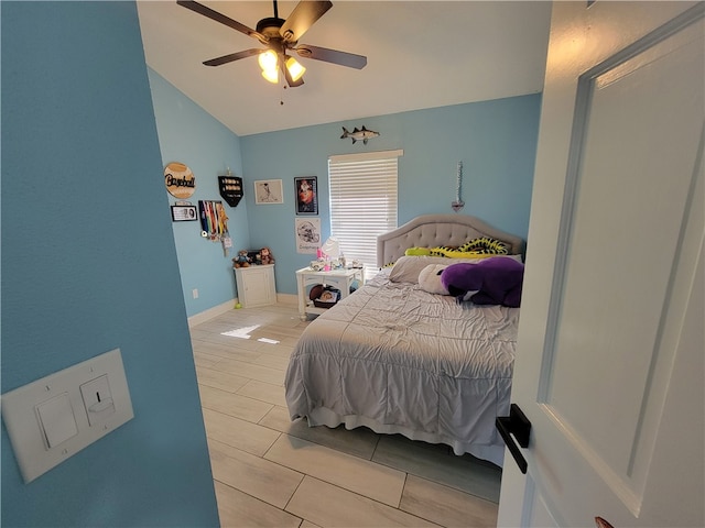 bedroom featuring ceiling fan and lofted ceiling