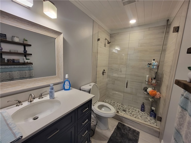 bathroom with tile patterned flooring, vanity, toilet, and an enclosed shower