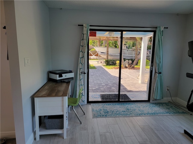 doorway to outside featuring light hardwood / wood-style flooring