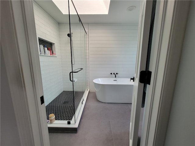 bathroom featuring plus walk in shower and tile patterned floors