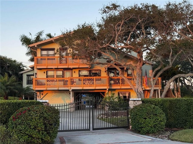 view of front facade with a balcony and a garage