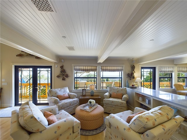 living room featuring beamed ceiling, wood-type flooring, french doors, and wooden ceiling