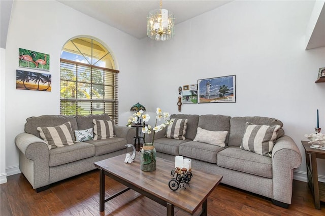 living room featuring dark hardwood / wood-style flooring and a chandelier