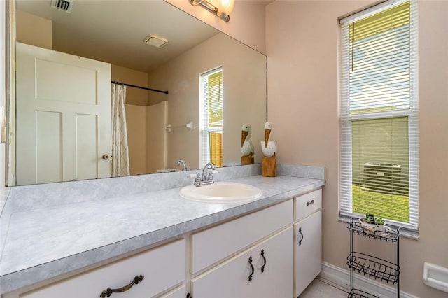 bathroom featuring vanity and a shower with curtain