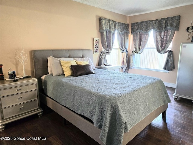 bedroom featuring dark wood-type flooring