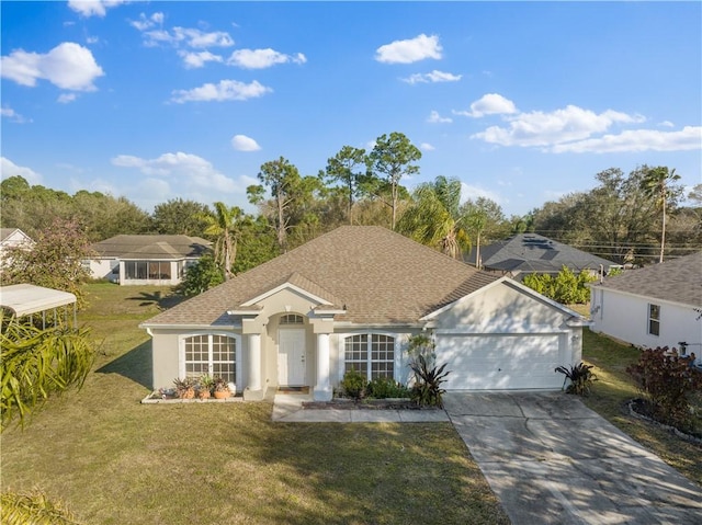 ranch-style home with a garage and a front lawn