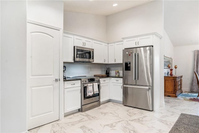 760 Holden Ave, Sebastian, FL 32958 - kitchen with appliances with stainless steel finishes, white cabinets, dark countertops, and recessed lighting
