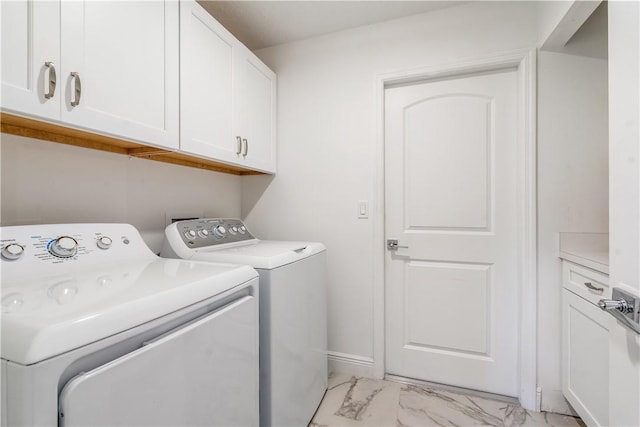 760 Holden Ave, Sebastian, FL 32958 - laundry area with washing machine and clothes dryer, cabinet space, and light marble finish floors
