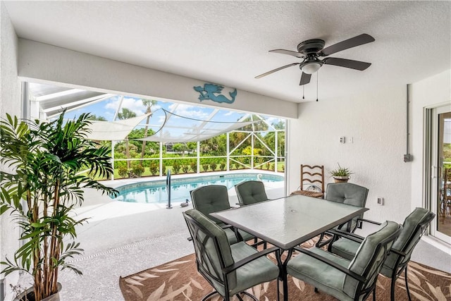 760 Holden Ave, Sebastian, FL 32958 - view of patio with a ceiling fan, an outdoor pool, outdoor dining area, and glass enclosure