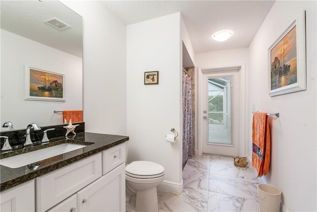 760 Holden Ave, Sebastian, FL 32958 - bathroom featuring marble look tiles and vanity