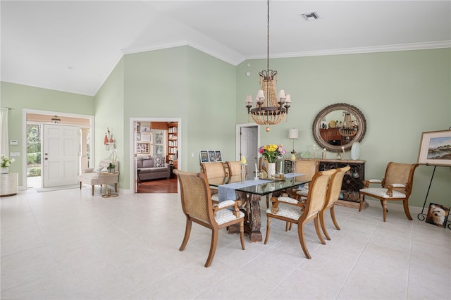 dining area featuring high vaulted ceiling, visible vents, baseboards, ornamental molding, and an inviting chandelier