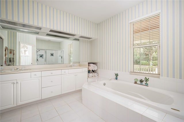 full bath featuring double vanity, wallpapered walls, a stall shower, a garden tub, and a sink