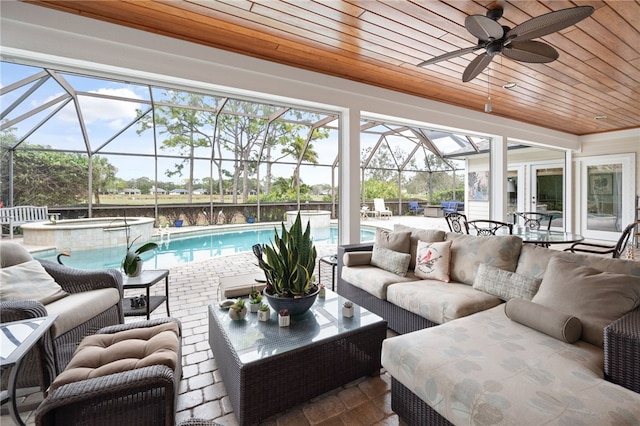 exterior space with a ceiling fan and wood ceiling