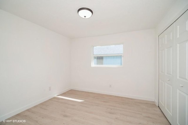 7645 58th Ave, Vero Beach, FL 32967 - empty room with baseboards and light wood finished floors