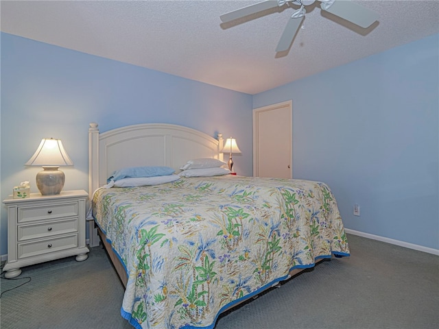 bedroom featuring ceiling fan, baseboards, dark colored carpet, and a textured ceiling