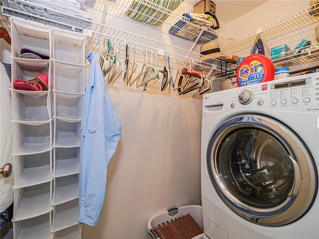 laundry area featuring laundry area and washer / clothes dryer