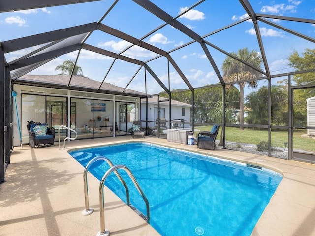 outdoor pool with a patio and a lanai