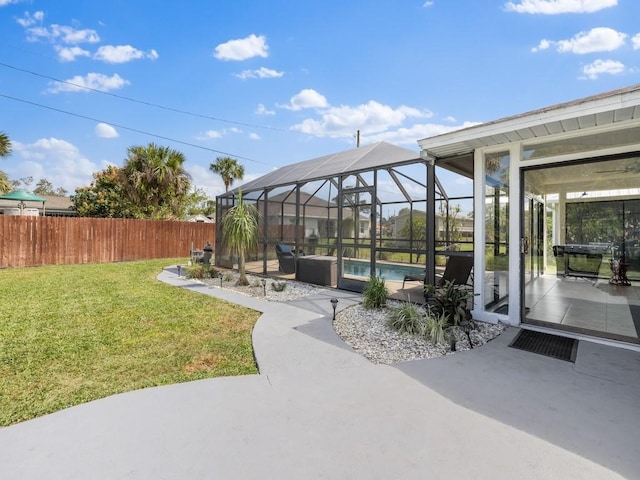 view of patio / terrace with a fenced backyard, a fenced in pool, and a lanai