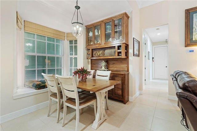 dining room with light tile patterned flooring and an inviting chandelier