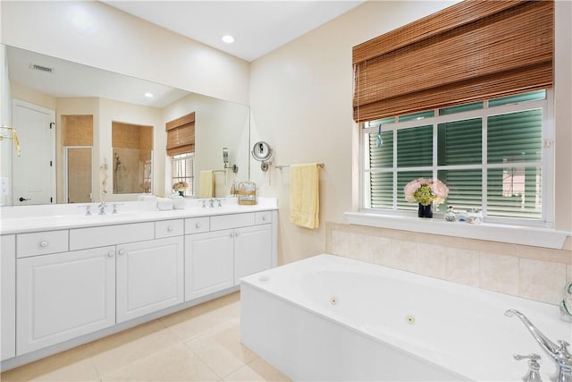 bathroom with shower with separate bathtub, vanity, and tile patterned floors