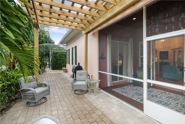 view of patio / terrace with a grill and a pergola