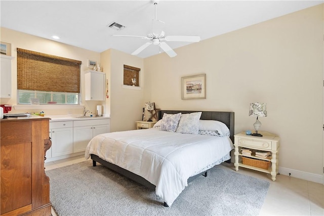 tiled bedroom with ceiling fan